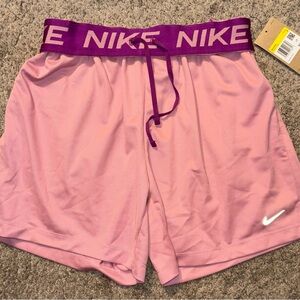 Nike Women's Light Pink Athletic Shorts with Purple Waistband